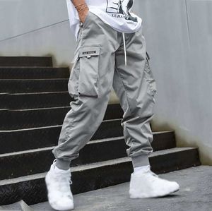 Mäns jeans 2024 Fashion Mens Cargo Pants Byxor Hip Hop Jogger Pocket Purple Mens Street Sports Pants Korean Ankle Length Pants J240507