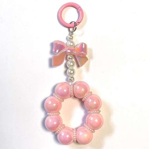Nuovi accessori per sacchetti per telefoni cellulari a corda di arco e perle, fibbia rotonda in appendi, perle colorate per le amiche