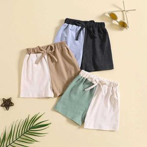 Roupas conjuntos de roupas de menino de menino contraste shorts coloridos de cor de arco elástico de cintura casual calça curta primavera verão outono calças curtas casuais h240508