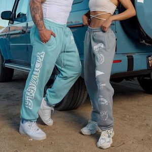 Men's Jeans Jogging mens sports pants American style mens clothing gym sports fitness cotton casual pants printed mid waist drawstring pants J240507