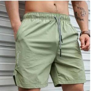 Shorts masculinos 2024 New Men Gym Fitness shorts soltos de fisiculturismo Joggers Summer Summer seco rápido calça curta masculina Marca de praia casual Pontas de moletom Y240507