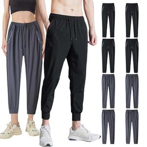 Calça masculina 2024 calças de verão finas moda slim noventa pontos para lazer masculino calça de pés pequenos com bolsos com zíper