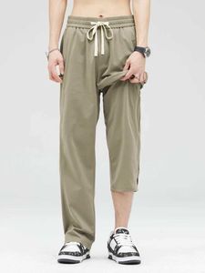 Męskie spodnie Summer jasne cienkie męskie spodnie dresowe koreańskie drapowane luźne dzianinowe sznur sportowy lodowy sznurka prosta spodni H240508