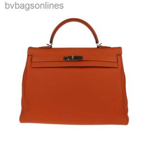 高品質の高度なHREMMSレザーバッグデザイナー女性バッグ新しいオレンジシルバーボタンKelyy 35レディースKelyyバッグ