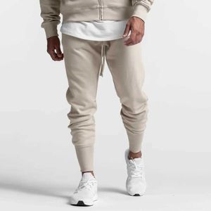 Męskie spodnie solidne joggery spodnie dresowe mężczyźni swobodne szczupłe spodnie bawełniane spodnie Męskie dno gimnastyczne jesienne na świeżym powietrzu tracki sportowe T240508