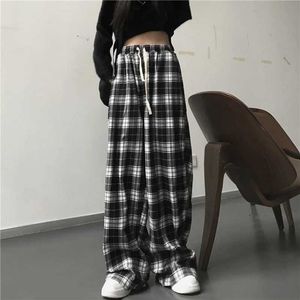 Spodnie damskie Capris duże damskie spodnie sportowe Modne czarne kratę swobodne z elastycznymi kieszeniami talii unisex hip-hop luźne Q240508