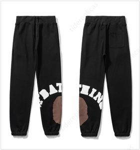 designerskie spodnie męskie spodnie vintage cargo spodnie joggery dresowe cargos graffiti drespant jogger pantalon High Street Hip Hop pary