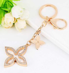 Yaratıcı Yonca Keychain Altın Anahtar Tutucu Metal Anahtar Zinciri Moda Anahtar Teyp Çantası Otomatik Kolye Hediyesi Bütün G10193992121