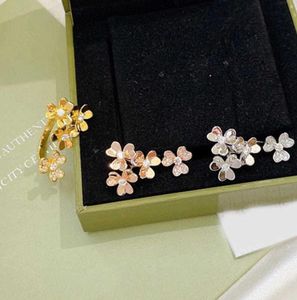 Nya varumärkesfestsmycken för kvinnor Guldfärg 4 Blommande ringar Manschett Justerbara ringar Bröllopsmycken Ringar Luxury Brand1706687