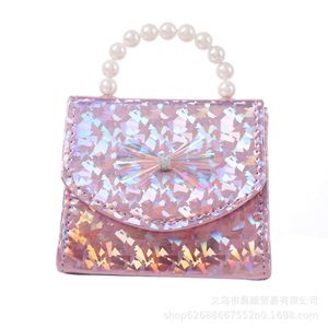 Xiaoxiangfeng Summer Ny mousserande paljett Bowtie Pearl Handheld Crossbody Children's Bag 78% Factory Wholesale