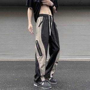 Męskie spodnie houzhou technologicznie sparochitute spodnie męskie splicing praca zamek błyskawiczne luźne męskie ubrania ubrania letnie ulicy hip-hop splicing 5xll2405