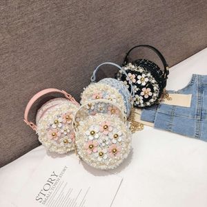 Nuova versione coreana per bambini Accessori versatili per ragazze, piccola borsa rotonda, simpatica ragazza di fiori perle perle 78% di fabbrica all'ingrosso