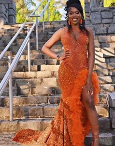 Pomarańczowe luksusowe afrykańskie wieczorne sukienki recepcyjne dla kobiet błyszczące diamentowe pióra aksamitne rozcięcie Stunka Black Girl
