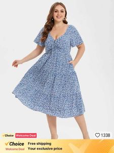 Abiti più taglia abbigliamento plus size Womens casual Summer Nuovo nodo di stampa floreale Abbollo con volant Midi Abito midi per la vita dimagrante e il vestito floreale Y240510