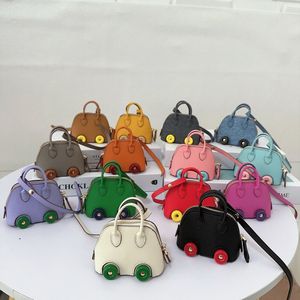 Keychains woman designer Top Quality backpack keyrings pendant Mini Wheel shell bag pendant Cute lipstick headphone bag Car key Chain accessories