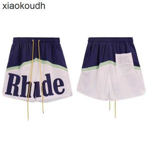 Rhude High end designer shorts for Fashion Letter Printing Casual Shorts for Mens Summer Loose Wide Leg Mesh Pants Couple With 1:1 original labels