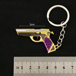 Mini Purple Gold Trendy Pistol Gun Toy Model Keychain Pendant 5cm Car keychain Zinc alloy Metal material integrated molding three-dimensional carving