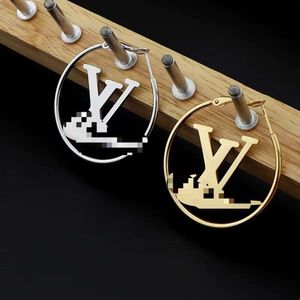 Titanium steel hook letter earrings are popular on the internet, with the same style of hook earrings featuring personalized street hip-hop style for men and