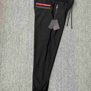 Spring and summer mens elastic lace-up trousers Haren pants polyester fabric soft comfortable and breathable leisure sports fashion.