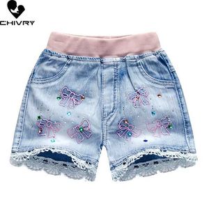 Shorts Nya 2022 barn och flickor sommar denim shorts baby flickor söt tecknad broderade spetsar shorts casual jeans shorts d240510