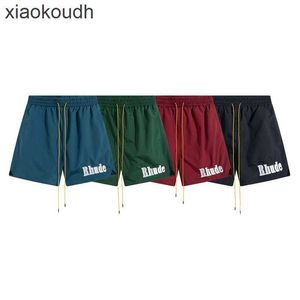 ストリートファッションのためのrhudeハイエンドデザイナーショーツソリッドカラースポーツショーツ男性用刺繍ビーチパンツ1：1のオリジナルラベルを持つカップル向けのクイックショーツ