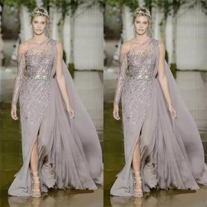 2018 فساتين متواضعة Zuhair Murad Prom مع ترتر حزام المعادن تول ترتر A-LINE تقسيم كتف واحد بالإضافة إلى العباءات المسائية الحجم 260S