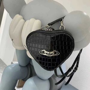 Kvinnors ryggsäck viviane westwood väska enkel trendig crossbody väska små designer väskor fast färg mångsidig axel handväska 240123 240511