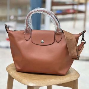 French Style Cowhide Dumpling Bag Hand-held One Shoulder Large Cowhide Commuting Bag Large Capacity Crossbody Bag Adjustable Shoulder Straps