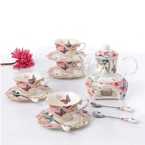 Tazze di piattini sakura farfalla fiore tè da tè set di caffè riscaldabile da tè caldo teatro teiera in ceramica tazza di piattino set