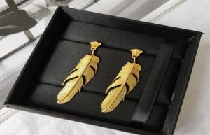 Vintage head of European and American wind gold feather earrings luxury custom brass plated S925 silver needle earrings3000922