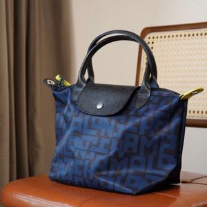 High Quality New Printed Hand-held Crossbody Bag for Men and Womens Casual Bag 1512 Small Letter Dumpling Bag