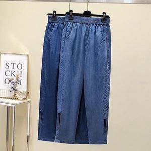 Женские брюки плюс размер самка летние ультратонкие лиокель джинсовая джинсовая ткань прямой пляж