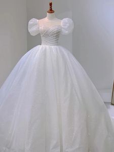 Glitter White Sequined Wedding Dresses With Pearls Beaded 2024 Short Puff Sleeves Bow Back Long Princess Bridal Gowns Court Train