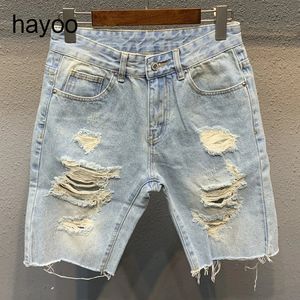 Ripped denim shorts mens light blue fifth pants trendy all-match mens loose woolen shorts Mens split stitching short jeans 240511