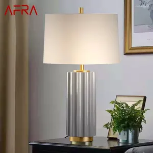 テーブルランプAFRAモダンなセラミックランプは、家のリビングルームのベッドルームの装飾のための創造的なシンプルなベッドサイドデスクライトを導いた