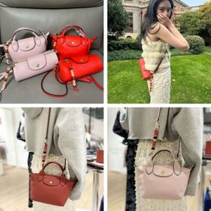 High Quality New French Mini Cowhide Beaded Dumpling Bag Can Be Carried on One Shoulder Crossbody for Womens Bag Beaded Pen Holder Bag