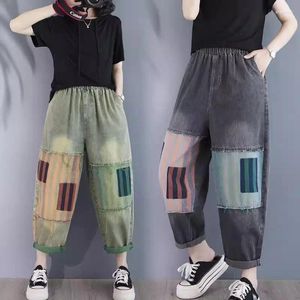 Calça feminina jeans de emenda artística para o verão 2024 Logo e emagrece as calças de jeans de harém casual mendigo K889