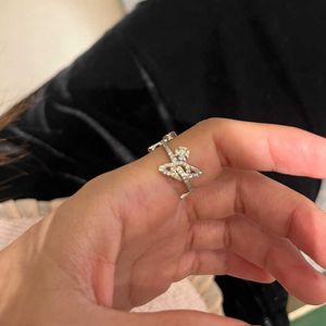 Marke hochwertige Westwoods Full Diamond Diagonal Set Drei Saturnringe exquisit mit Hohlebene Planet Index Finger Ring Nagel