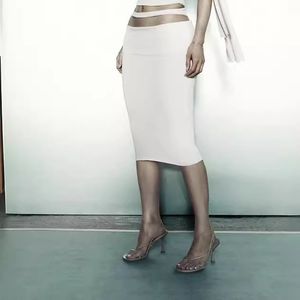 Kylies Khy-stil utskuren midja strappy kjol är en stretch smal midi kjol