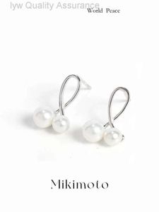Pearl Pearring Projektant Mikimoto kolczyki Mikimoto drewniane krzyżowe kolczyki dla kobiet w czystym srebrze z luksusowym poczuciem nowej niszu luksusowego luksusowego niszu 195