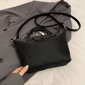 Modehandväska 80% fabrikskampanjer Ny vatten hink nylonduk handbill axel stor kapacitet crossbody womens väskor s