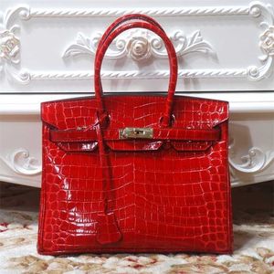 Women's Platinum 2024 Designer Bag Crocodile Pattern Women's äkta läder Kvinnors handväska Personlighet O996