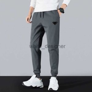 Pantaloni maschili designer pantaloni della moda pantaloni sportivi jogger di cotone di alta qualità pantaloni di asciugatura casual pantaloni fitness pantaloni da strada