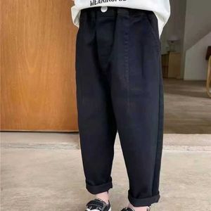 Trousers Shorts 2024 New Baby Pants Solid Color Childrens Leather Cover Fashion Trousers Loose Panel Pockets Harajuku Pants Solid Color Childrens ClothingL2405L
