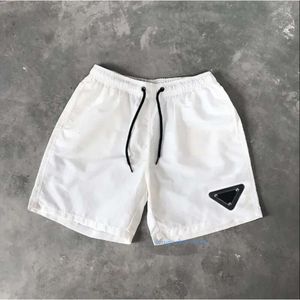 Män shorts designer mens badkläder kvinnors strand kort lyxig vattentät metall etikett andningsbara sport yoga byxor sommarkläder man outfit