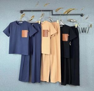 Högkvalitativ pullover för kvinnlig designer Spring/Summer Fashion Letter Brodery Label Ribbon Spliced ​​T-Shirt+Elastic midjeband Casual Pants Two-Piece Set