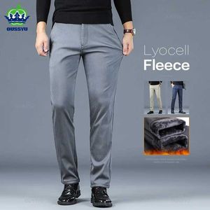 Męskie spodnie zimowe lyocell tkanina ciepłe flce męskie spodnie gęsto gęste praca Korea swobodne flockingowe spodnie męskie duże rozmiar 40 y240514