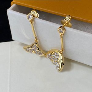 Designer jewelry Gold floral four-leaf clover pendant earrings