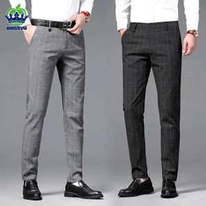 Męskie spodnie marka odzież Wysokiej jakości klasyka Plaid Prace Stretch Pants Men Business Prosty czarny szary impreza retro formalne spodnie Mężczyzna Y240514