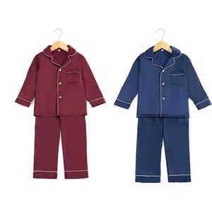 Pyjamas Wholesale Childrens Matching Pyjama sätter babykläder Ice Silk Satin Topps Skjortor Byxor Bojkar och flickor Pyjamas D240515